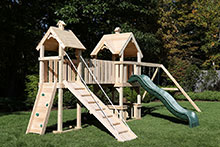 Wooden swing set with Rock wall climbing ladder.