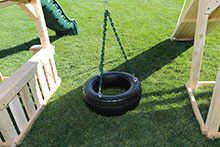 Tire swing under bridge.