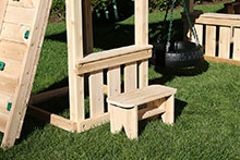 Wooden playset lemonade counter and bench.