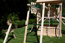 Triumph Play System's Kelton loaded cedar swing set with monkey bars.